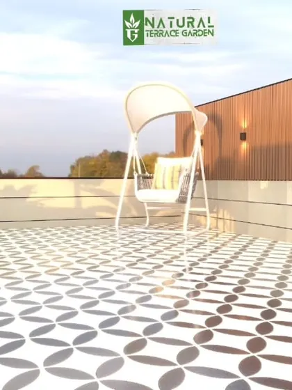 A proposed design for a simple and elegant patio area. The render features a swing set on a beautifully patterned tiled floor, with a wooden wall and accent lighting.