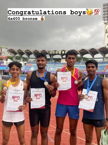Our boys' 4x400 relay team with their bronze medals and certificates after a hard-fought race.