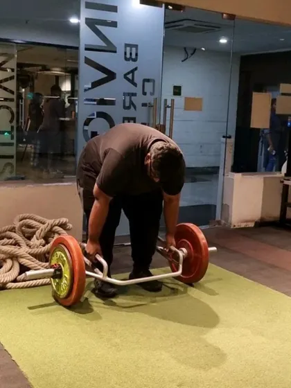A client performing a trap bar deadlift. This is a great variation for learning the deadlift pattern with less stress on the lower back.