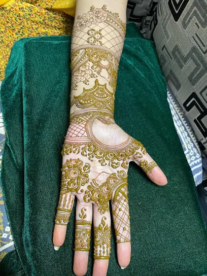 This is what a design looks like before all the filling is complete. You can see the outline of the floral and geometric patterns, showing the blueprint of the final piece.