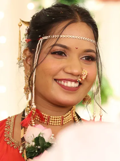 The classic red Nauvari look is a symbol of Maharashtrian tradition. I specialize in creating this iconic bridal style, complete with a radiant makeup finish, traditional jewellery, and a perfectly draped saree.
