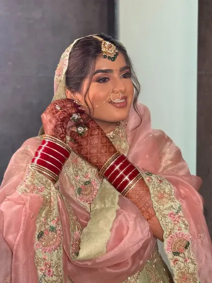 A series of shots of my beautiful bride Nam for her Lava wedding. She wore a lovely pastel pink and green suit, and we created a soft glam look with wavy hair that felt modern yet traditional.