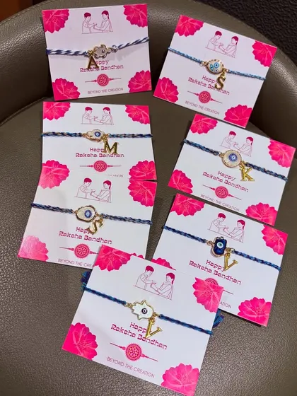 Protect your siblings with our elegant personalised evil eye Rakhis. They blend tradition with modernity and come on a beautiful backing card.