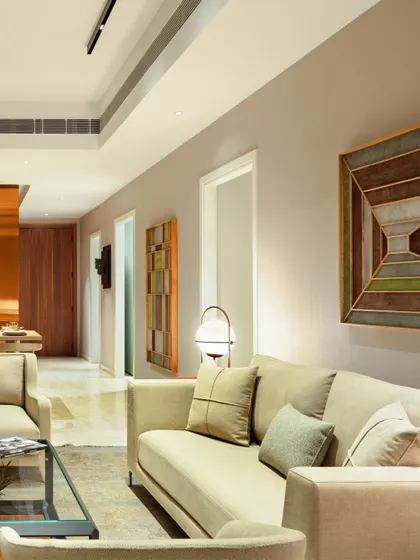 The interior of the Elevate apartment features a calm, neutral palette with carefully selected artwork. The design focuses on creating a flow between spaces, making the home feel connected and harmonious.