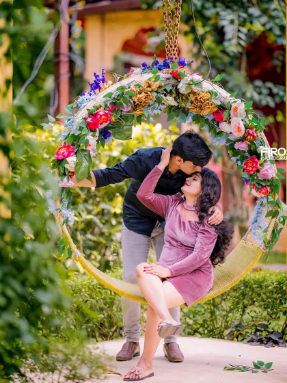 A tender and romantic moment on the floral swing. This portrait in casual wear feels intimate and heartfelt, perfect for capturing genuine emotion.