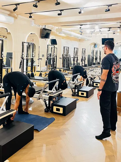 Behind the scenes, our passionate trainers practice what they preach. We are dedicated to our own journeys of strength and flexibility.