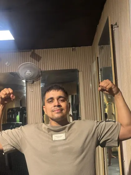 Flexing to show the results of dedication.