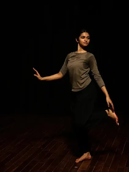 A dancer in a graceful pose during a tech run.