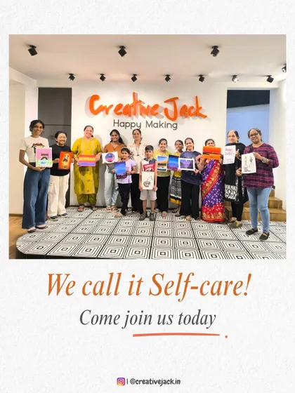 A large group of students of all ages stands together, proudly displaying the diverse artwork they created. I call it self-care, and you can join us too.