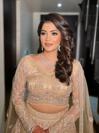 A final portrait of Krisha's sangeet glam. The focus is on radiant skin and beautifully defined eyes.