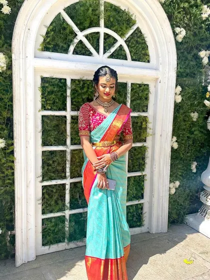 A candid shot showing the full traditional attire. The makeup and hair are designed to last throughout the day's festivities.