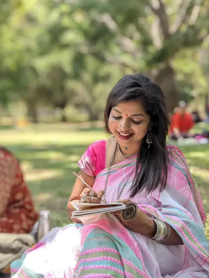 A candid moment of me smiling while painting in my sketchbook. The peaceful atmosphere of the park is the perfect backdrop for letting creativity bloom.