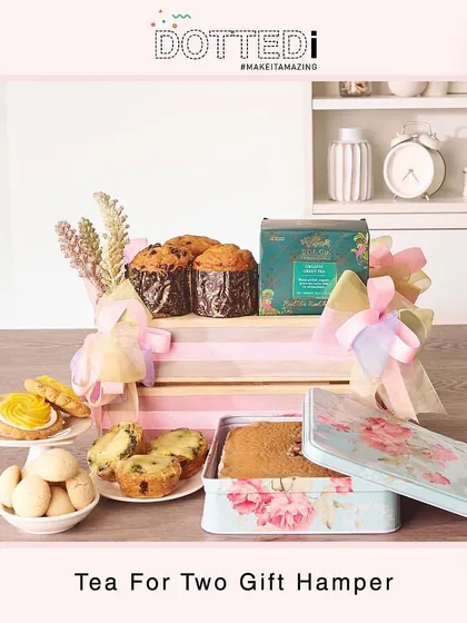 A beautifully arranged "Tea for Two" hamper, featuring an assortment of baked goods and premium tea, perfect for sharing a quiet moment together.