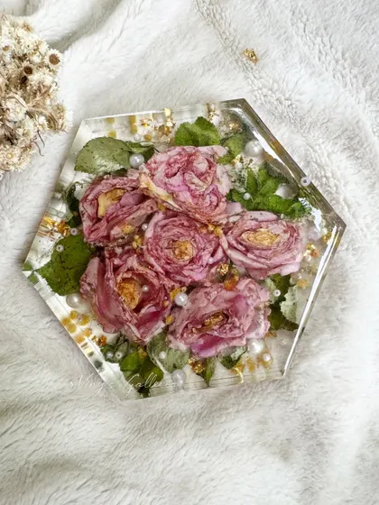 A special bouquet turned into a beautiful keepsake. This elegant hexagon block preserves gorgeous pink roses, capturing the magic of love and memories.