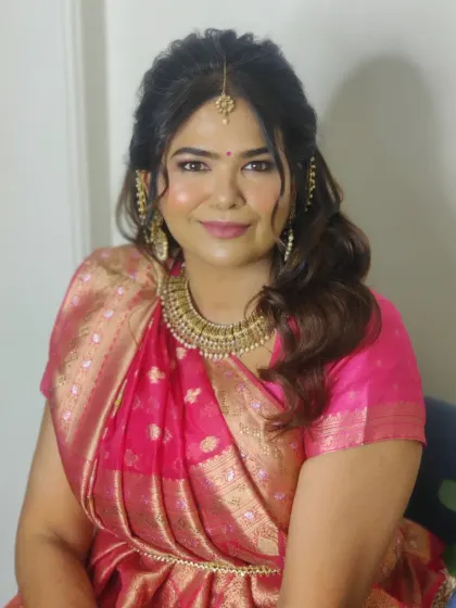 My client Swati in a beautiful pink saree with a traditional Gujarati drape for her second look.