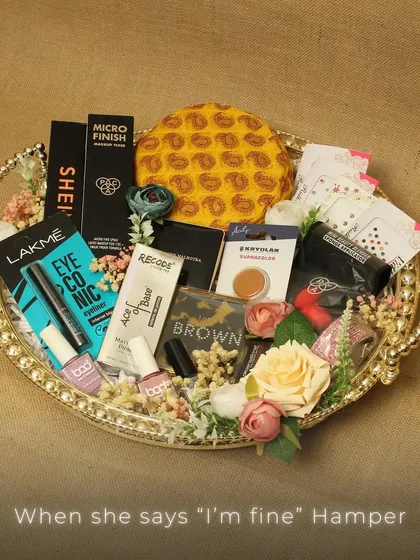 The "When she says 'I'm fine'" hamper. This curated tray of makeup and beauty products is a fun and thoughtful way to pamper someone special.