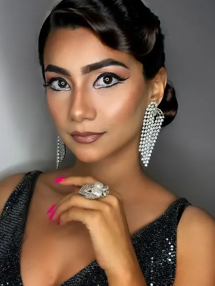 Different angles of the same striking look, showcasing the precision of the graphic eyeliner and the flawless, airbrushed-quality skin. This is a testament to the skills I teach my students.