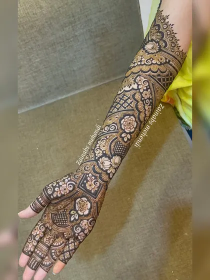 A complete view of Zeba's bridal arm, showing how the pattern flows from the palm to the elbow in a stunning, cohesive design.