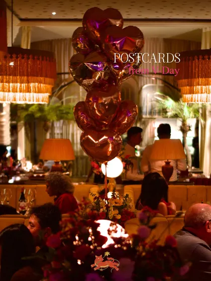 The dining room decorated for Valentine's Day, with heart-shaped balloons and floral arrangements creating a festive and romantic atmosphere.