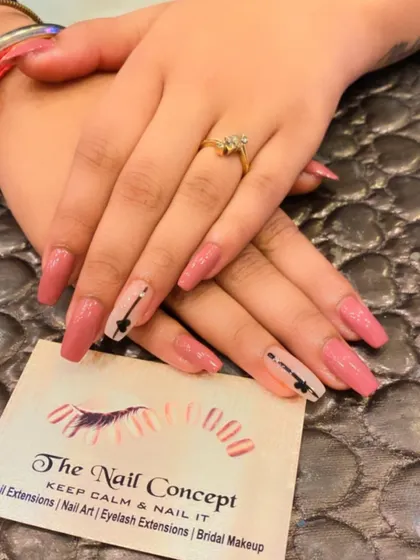 A simple yet cute design on long, square nails. The dusty rose polish is accented with a single nail on each hand featuring a hand-painted black arrow and heart.