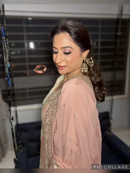 This side profile shows the soft curls at the back and the elegant hair accessory peeking through.