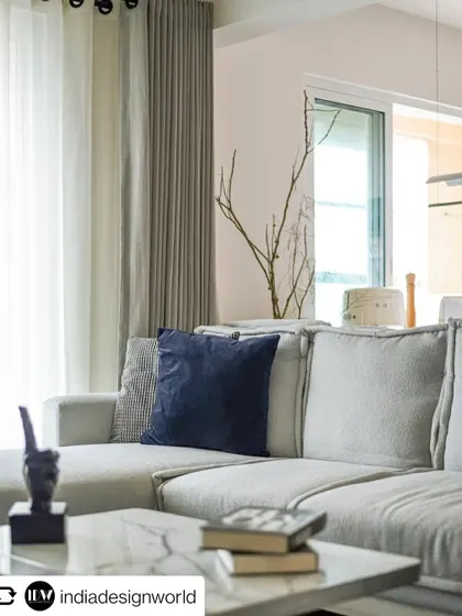 The comfortable and stylish living room sofa, featured in India Design World. The use of boucle fabric and a neutral palette creates a warm and inviting atmosphere.