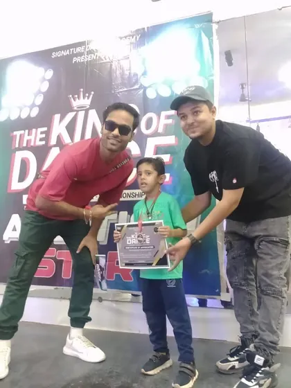 A proud moment as one of our youngest students receives his certificate at the King of Dance audition.