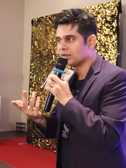 Another angle of me hosting, showing my dynamic presence on the mic.