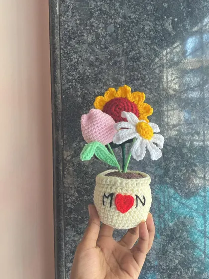 I love making custom gifts that tell a story. This special arrangement with a sunflower, tulip, and daisy was made for a lovely customer to gift their mom. I can personalize the pot with names or messages to make your gift extra special.