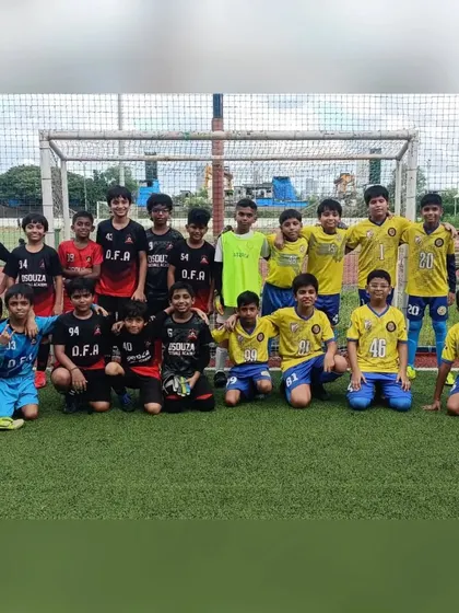 Our U11 team with their opponents from D'Souza Football Academy after a competitive friendly.