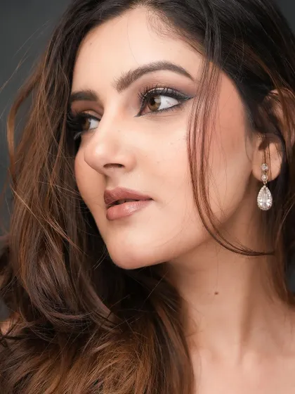 A side profile showcasing the winged liner and the soft shimmer on the lid. This is a classic glam look that I love to create.