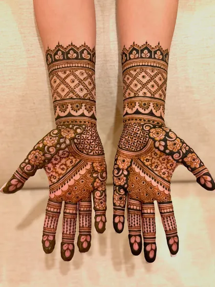 Samiksha's engagement mehendi, a beautiful example of floral and geometric patterns combined for a modern yet traditional look.