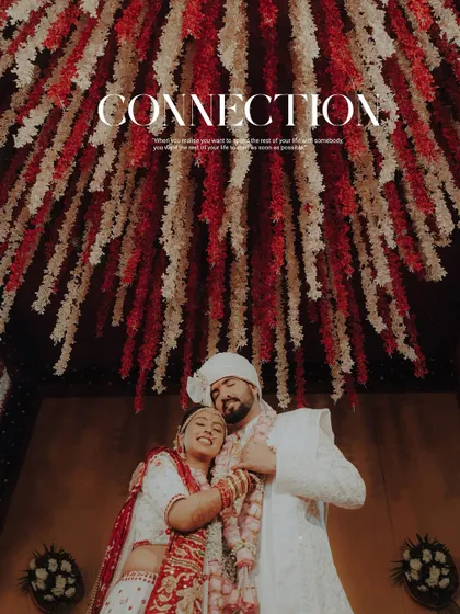 Connection. A beautiful portrait of the newly married couple under a stunning floral ceiling, sharing a warm embrace.