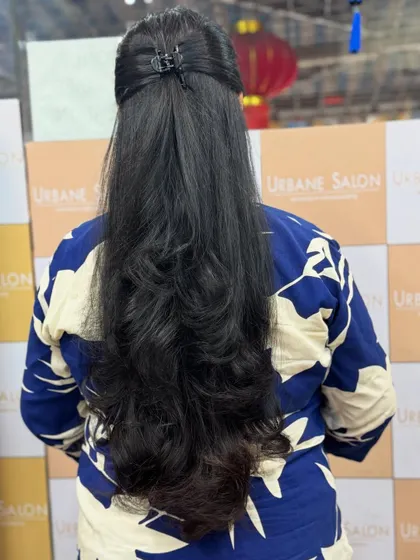 A simple half-up style is a great way to show off the layers and length of this beautiful haircut.