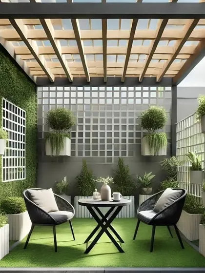 A structured and elegant green space. This design uses trellis panels on the walls for climbing plants and hanging planters, creating a formal garden feel. The symmetrical layout with a bistro set in the center makes it a perfect spot for morning coffee.
