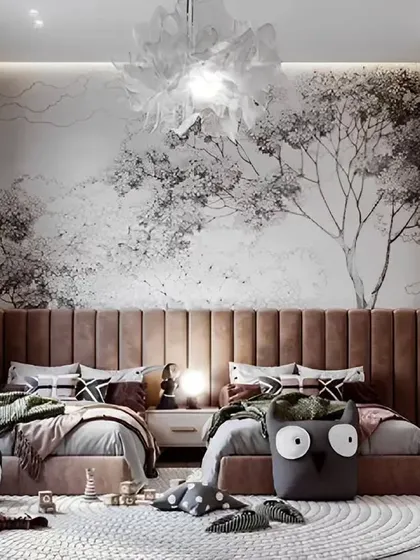 A nature-inspired shared bedroom with a beautiful forest mural and earthy tones. The design uses natural textures and cozy furnishings to create a calming and imaginative environment for siblings.