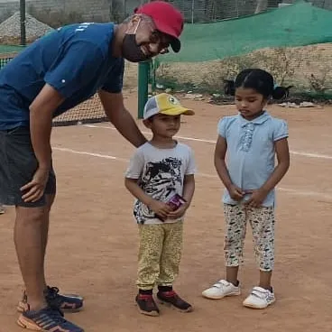 Taking a moment to chat with our youngest players after the weekly awards. I make sure every child feels seen and encouraged, which is especially important for beginner tennis lessons.