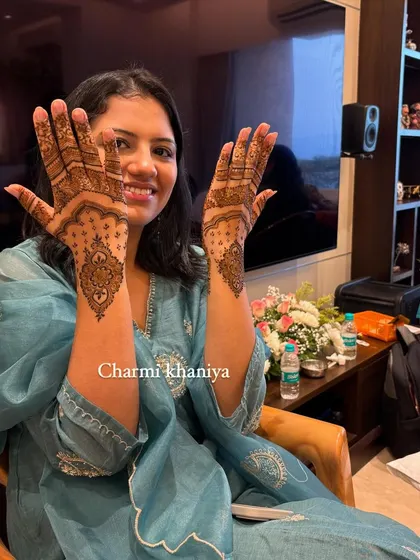 A happy client showing off her beautiful and elegant mehendi design. The minimalist style is so chic and modern.