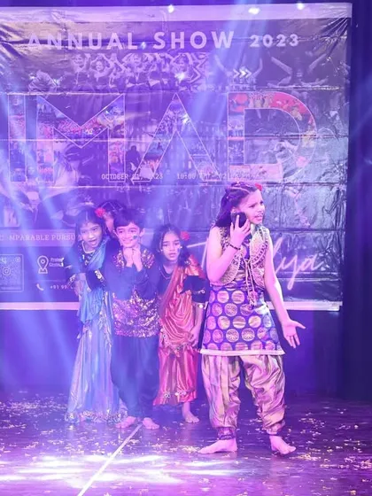 A colorful performance celebrating the festival of Holi, with dancers in vibrant costumes.