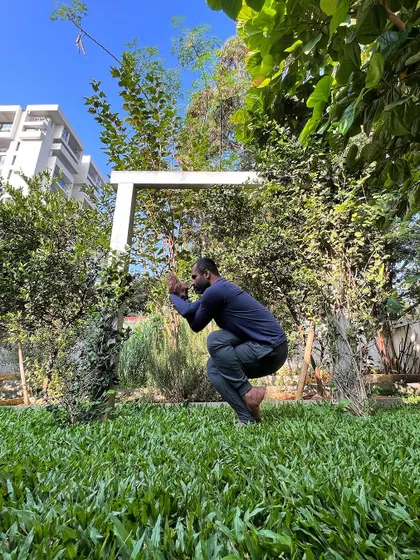 In every moment, we have the ability to pause and breathe before we act. This practice of finding stillness, even in a challenging squat, grounds our response in our true nature.