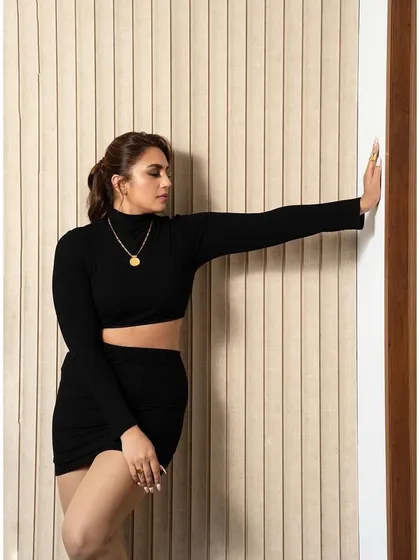 Another angle of the black two-piece set, showing its versatility and chic appeal.