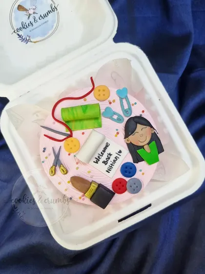 A closer look at the custom bento cake for a NIFT student. Every little detail, from the fabric swatches to the buttons, is handmade from fondant.