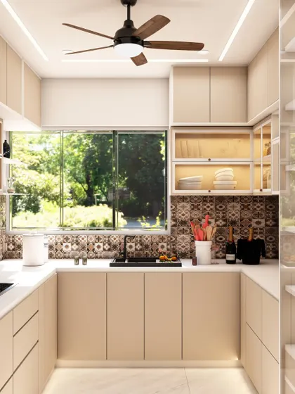 The full view of the U-shaped kitchen showcases the efficient work triangle and the abundance of natural light from the large window.