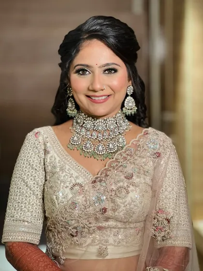 A happy, smiling portrait of the bride, looking fresh and beautiful for her reception.