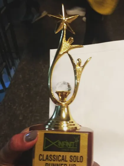 A close-up of our award for classical solo dance. This recognition fuels our passion for preserving and innovating with Indian dance forms.