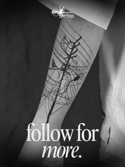 The finished abstract piece on Sammohit's arm. A unique tattoo representing connection, chaos, and freedom, brought to life with bold black lines.