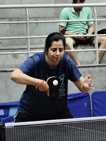 A veteran player demonstrates perfect form during a match. Our academy welcomes players of all ages, creating a diverse and challenging environment for everyone from juniors to seasoned veterans.