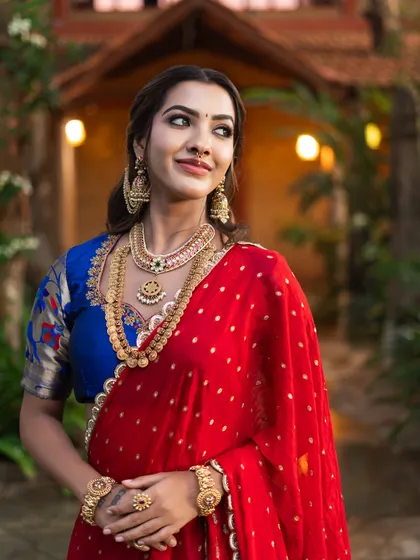 The bride looking radiant and happy. The makeup is designed to enhance her features and give her a confident glow.