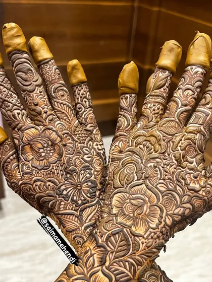 A beautiful, clean shot of a full-hand design, where you can see the incredible detail and precision of the floral and geometric patterns.