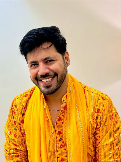 A close-up shot in my yellow Navratri outfit, sharing a happy and genuine smile. My expression is my best accessory.